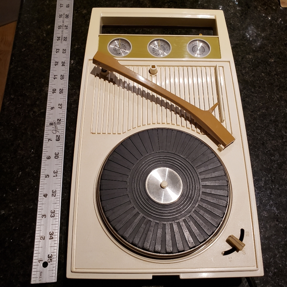 Simpson Sears vintage a m radio and phonograph player in working condition.